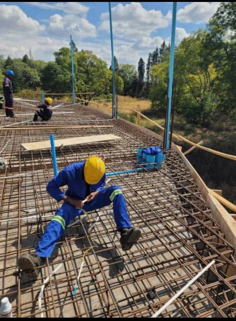 Conduit tubing installation on rebar concrete deck